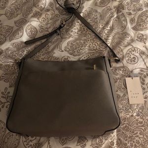 Gray hobo crossbody style purse.